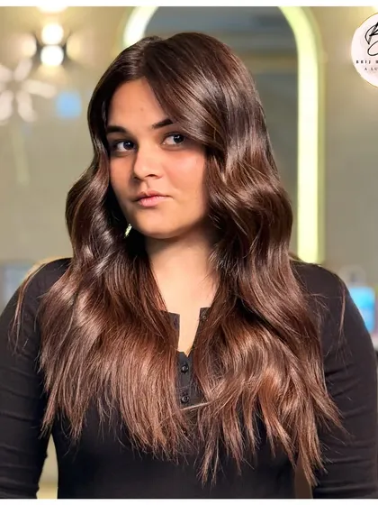 This final shot shows the beautiful movement and texture of her new brown hair. It’s a look that’s full of life and fearless energy.