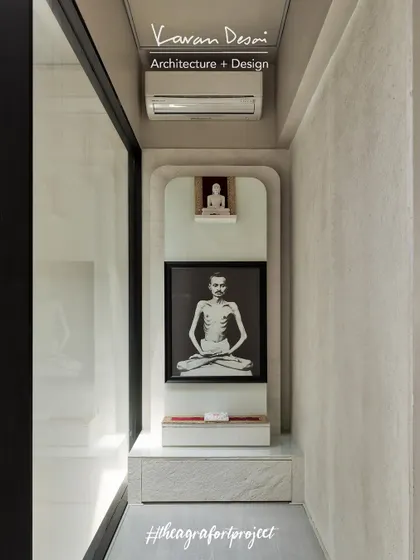 A small, intimate mandir space we created in the "Agra Fort Project." The design is simple and modern, with a clean white marble backdrop that allows the spiritual icons to take center stage.