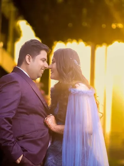 Using the warm glow of the setting sun, we captured this romantic pre-wedding portrait, highlighting the couple's happy expressions.