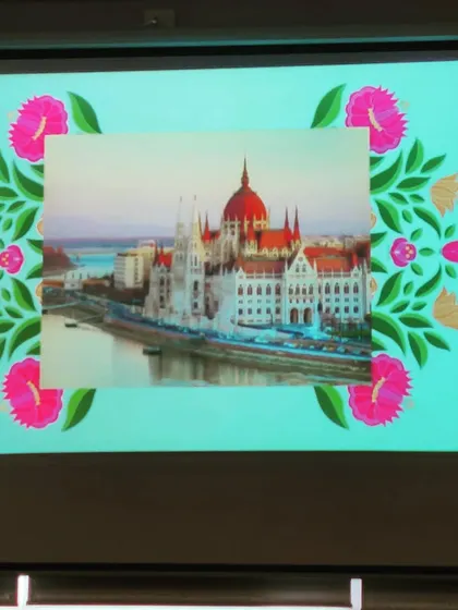 We use visuals like this projection of a Hungarian landmark to transport kids to the setting of our stories. It's a simple way to make world folktales feel more real and vivid.
