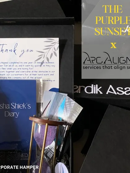 This hamper was designed for Arc.Aligned to celebrate their one-year anniversary. It includes a personalized diary, an elegant hourglass, and other desk accessories to thank their consultants for a successful year.