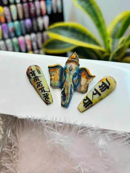 An alternate view of our sculpted Ganpati nail art, highlighting the incredible detail and color work that went into creating this three-dimensional tribute for the festival.