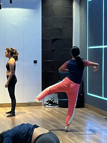 Students in a contemporary class practicing floor work and fluid movements. These exercises are fundamental to building a strong contemporary dance foundation.