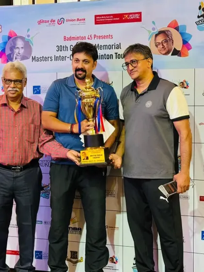Receiving the trophy for one of my wins at the GD Birla tournament. It's always an honor to compete and succeed.