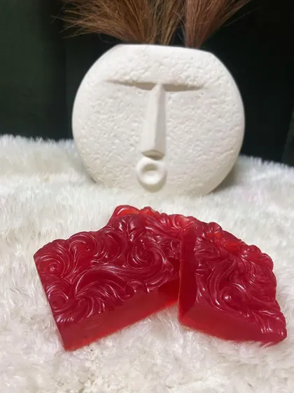 A close-up of my handcrafted Red Wine soaps. The rich color and intricate design make them a beautiful and beneficial addition to your bath routine.