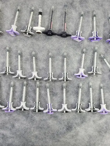 These are pre-filled syringes of hyaluronic acid-based dermal fillers, such as Juvederm. I use these to restore lost volume, smooth out deep wrinkles, and enhance facial contours like the jawline and cheeks for a natural, refreshed look.