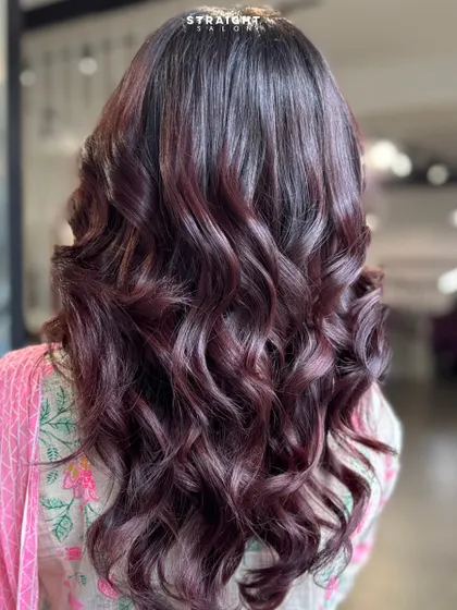 When your hair color does all the talking. Serving luxe waves in a dreamy, deep burgundy hue.