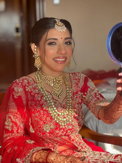 Checking her reflection one last time. That look of satisfaction is what I strive for with every bride.