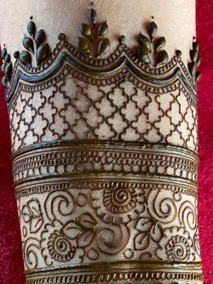A close-up of the fine details in a cuff design. I take great care to ensure every element, from the jaali net to the leafy border, is executed with precision.