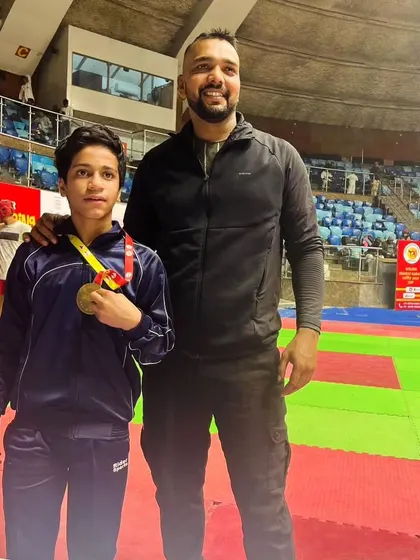 Standing tall with a young champion. His hard work and dedication are an inspiration.
