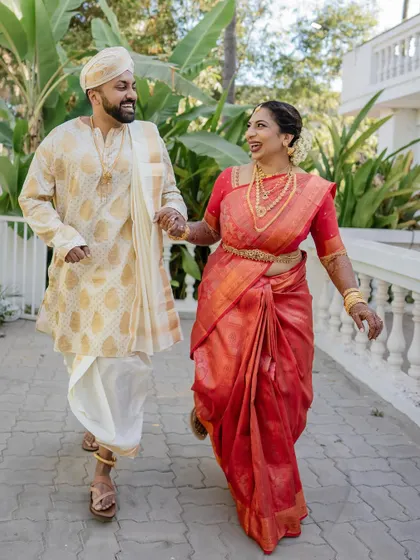 A fun and playful moment where the bride lifts the groom. We love capturing the unique personalities and humor of our couples, showing that weddings are all about joy.