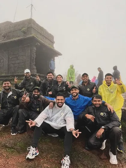 The team at the ancient temple atop Kodachadri peak, shrouded in mist. This trek offers a unique blend of adventure, spirituality, and natural beauty.