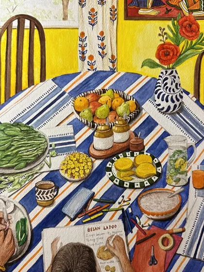 A table full of food, hands at work, and a recipe being written down by a child. This is how we pass on not just ladoos, but memories and love.