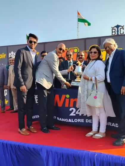 Celebrating victory at The Winfair247 Bangalore Derby. The winning connections receive the trophy, marking a historic moment in the winter racing season.