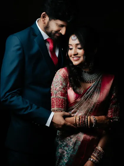 A classic and elegant portrait of the couple in their reception attire, their love and happiness on full display.