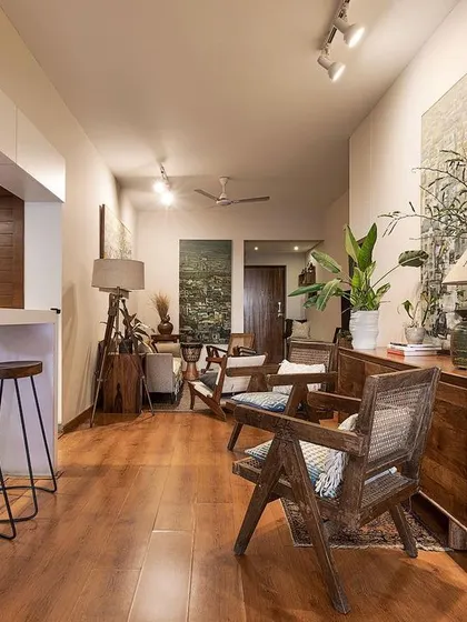 The open living area of 'Reweave Stories' features a breakfast bar and comfortable seating. Opening up the kitchen was a key decision to make the home feel more connected and social.