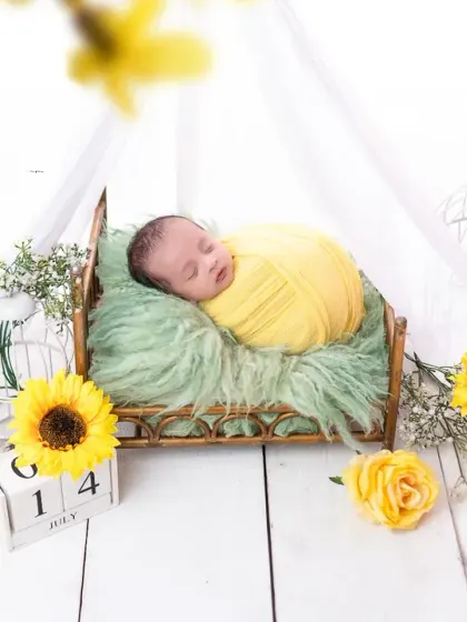 A dreamy shot of our sunflower-themed newborn session, with a soft focus that adds a magical touch. I use different angles to provide a variety of beautiful images.