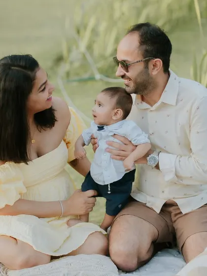 A sunny day, a happy family. Outdoor sessions like this picnic theme are perfect for capturing natural and relaxed family interactions.