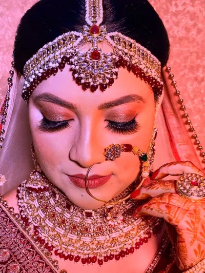 A close-up of this bride's makeup, focusing on the soft glam eyeshadow and the full, feathery eyelash extensions that define her eyes.
