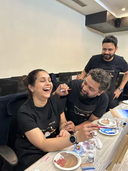This is what it's all about! Pure, unadulterated joy and laughter during a team painting session at GoLive. These are the moments that build stronger teams.