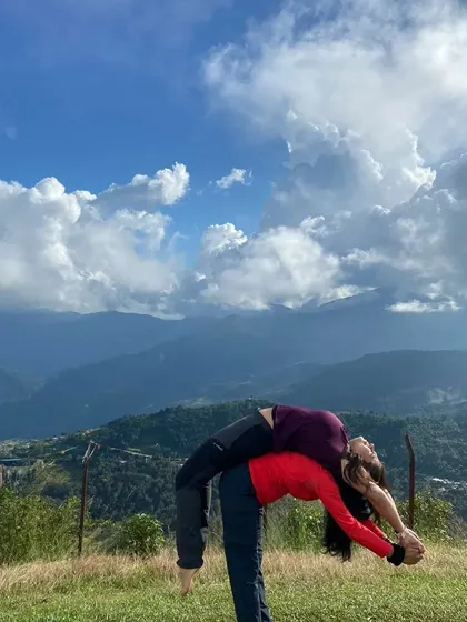 A partner backbend with the expansive sky and mountains behind us. This was an extraordinary experience of trust, support, and connection with both my partner and nature.