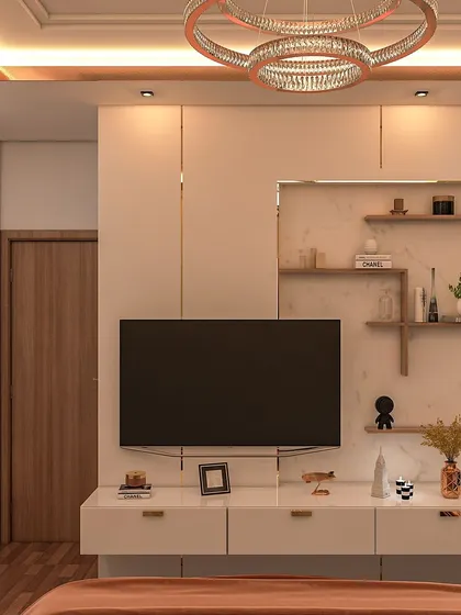 The TV unit in Trisha's bedroom is sleek and functional, with a floating console and open shelving set against a clean, white paneled wall. The statement chandelier adds a final touch of glamour.