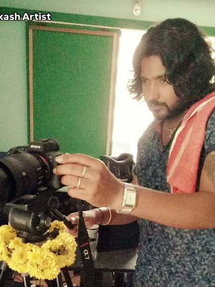 A throwback photo of me behind the camera. My journey in the creative field started long ago, and my passion for art has always been my driving force.