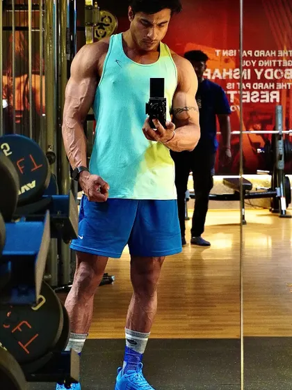 A confident stance, ready to ignite the fire for another intense workout.