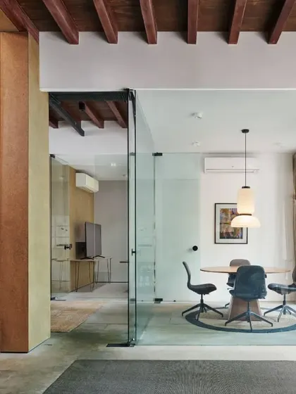 Transparent glass walls and a large arched window allow our conference room to be visually connected to the rest of the office, while a warm timber ceiling adds a welcoming touch.
