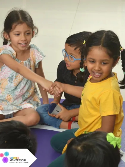 Children learn to resolve conflicts and show courtesy to one another, like with this simple handshake. These are the social skills that prepare them for life.