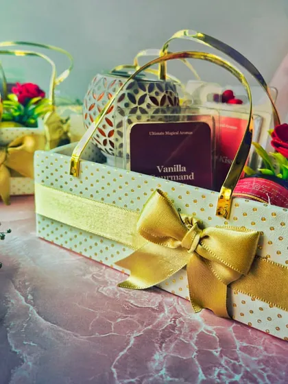 Another angle of the custom gift baskets, showing the Vanilla Gourmand wax melts and a patterned wax warmer. I love helping my clients spread warmth and love.