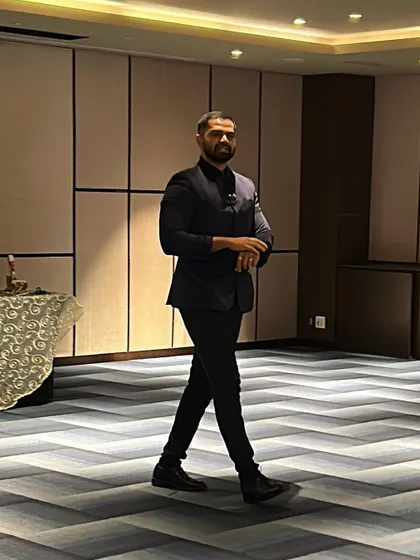 In motion during an indoor corporate event. I am constantly moving and interacting, ensuring a dynamic and engaging atmosphere for everyone present.