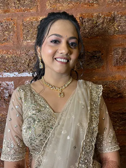 A happy, smiling bride ready to dance the night away at her sangeet.