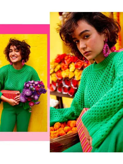 A monochromatic green look from the campaign. Styling a chunky knit sweater with matching pants creates a strong color story that makes the pink accessories stand out beautifully.