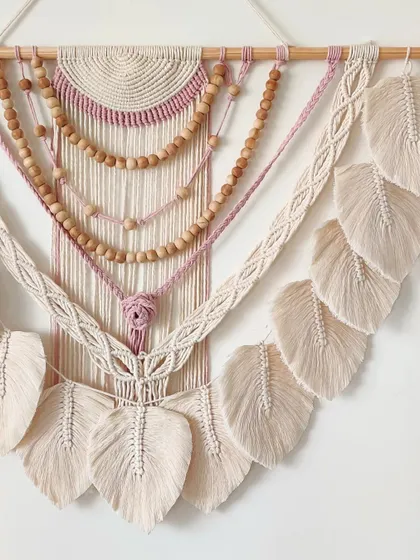 A close-up of the top section, showing the semi-circle pattern and the start of the beaded layers.