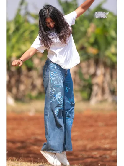 A joyful jump in my custom-painted jeans. Wearable art should be fun and make you feel free.