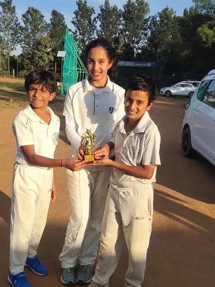 Teamwork makes the dream work. Three of our young champions proudly holding their tournament trophy after a fantastic team effort on the cricket ground.