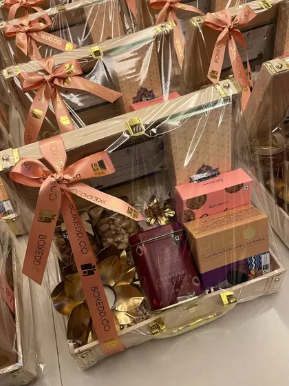 A large batch of our wooden trunk hampers, wrapped and ready for Diwali delivery. This shows our capacity to handle high-volume orders while maintaining a high standard of presentation.