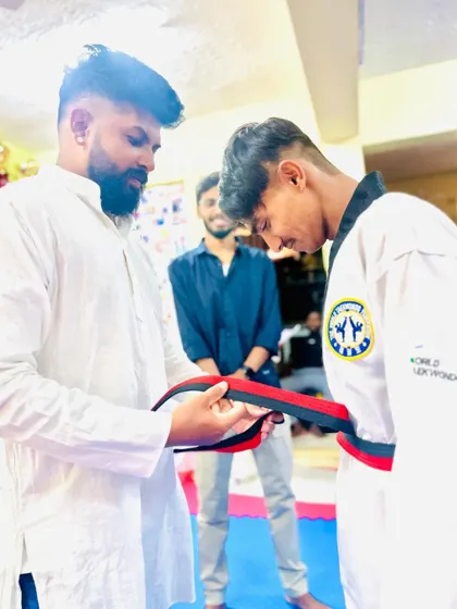 The final tie of the red and black belt.