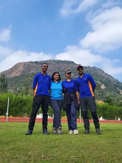 Our team of instructors standing in front of a mountain, ready for the day's trek. We are your guides to unforgettable adventures.