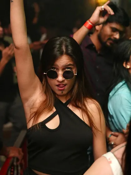 A cool and confident partygoer enjoying the night.