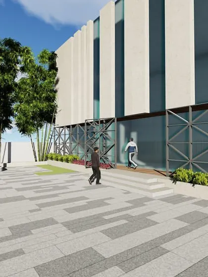 A view of the public plaza and flag post area for the Sonari Grampanchayat office, designed to be a functional and proud community space.