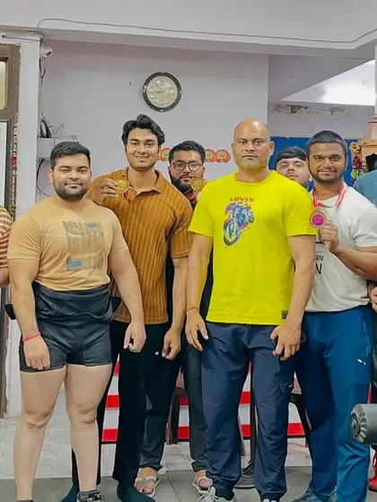 The team at Powerlifting Studio after a successful competition. The medals and trophies are proof of their dedication and our collective effort.