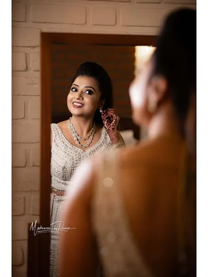 A getting-ready shot of Ashwini, admiring her look in the mirror.