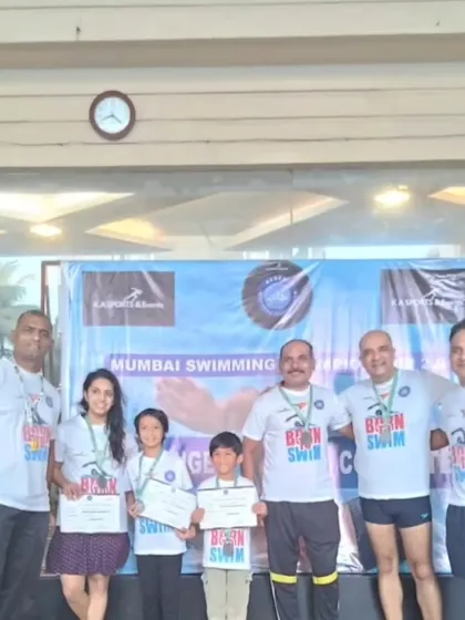 Our family of swimmers, both young and old, celebrating together. Swimming is a sport that bridges generations, and our team reflects that diversity and shared passion.