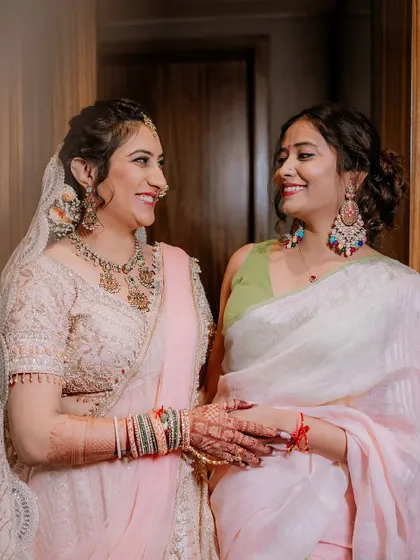 A heartwarming shot of the bride sharing a moment with a loved one before the ceremony.