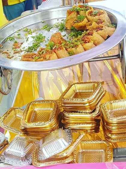 Beyond traditional Indian snacks, I also offer popular appetizers like these vegetarian spring rolls, served hot from a chafing dish.
