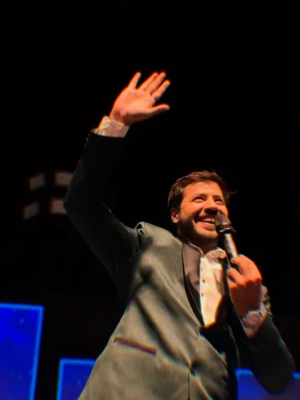 Waving to the family and friends, creating a warm and interactive atmosphere. A great Sangeet is one where everyone feels connected.