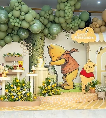 Another view of the Winnie the Pooh baby shower stage, showing the full setup with "BABY" blocks.