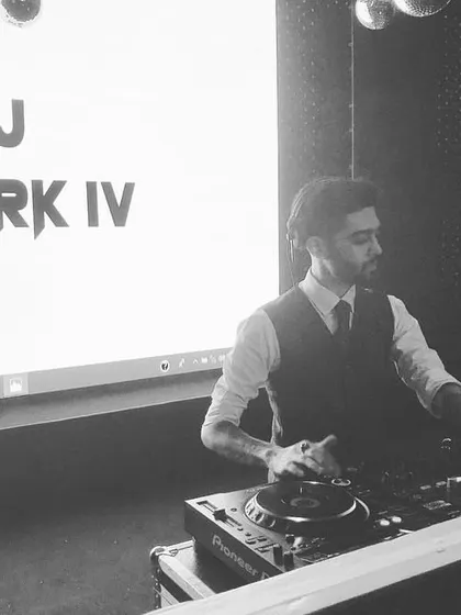 Behind the console at a Goa wedding. My branding is consistent, but my music is always tailored to the specific event, location, and crowd.